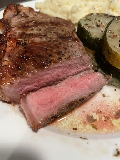 steak with mashed potatoes and zucchini