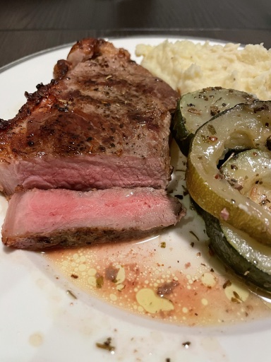 steak with mashed potatoes and zucchini
