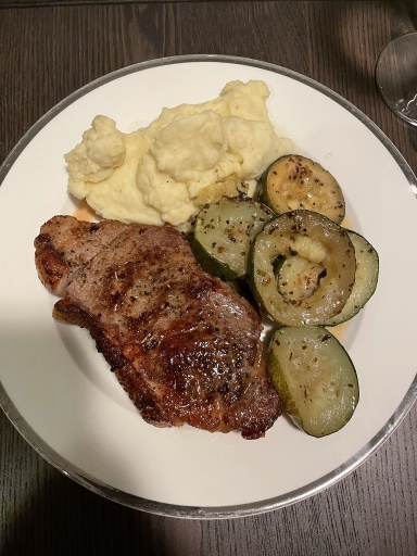 steak with mashed potatoes and zucchini