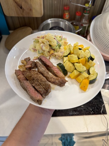 steak with potato salad and roasted squash