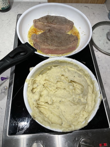 steak with mashed potatoes and zucchini