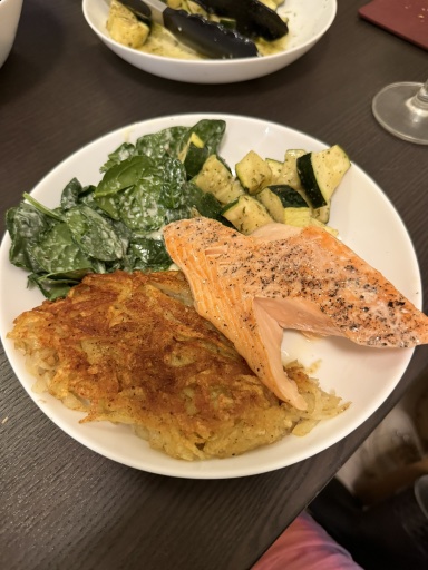 salmon with hash browns and vegetables