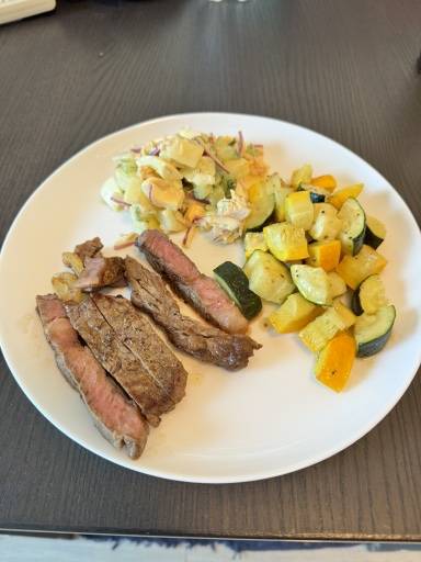 steak with potato salad and roasted squash
