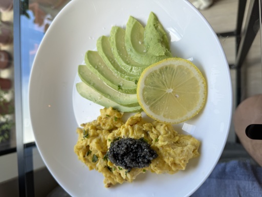 scrambled eggs with caviar and avocado